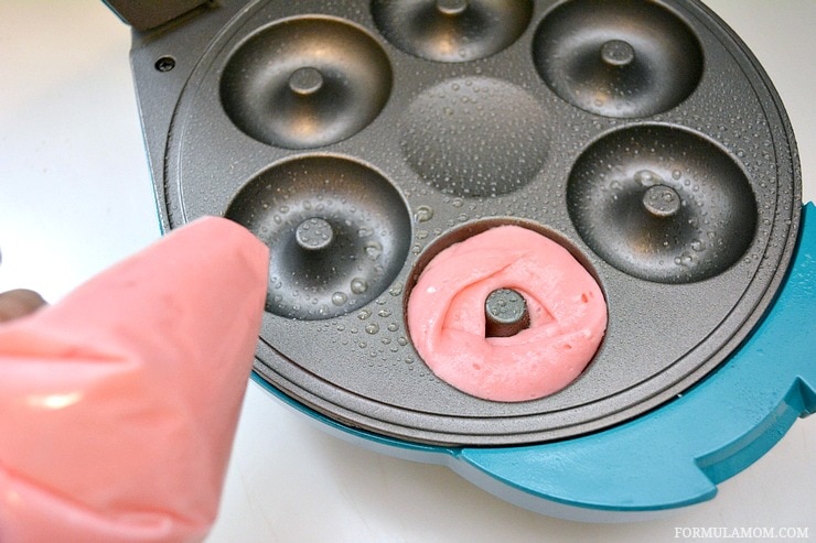 Whether it's breakfast, snack time, or party time this easy homemade doughnut recipe is perfect for your family! Making Cake Mix Doughnuts with a doughnut maker means easy treats in minutes!