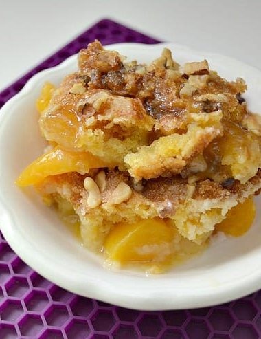 Need a quick dessert recipe? Try this Easy Peach Cobbler Cake with this easy cake mix recipe! It's sure to be a crowd pleaser!