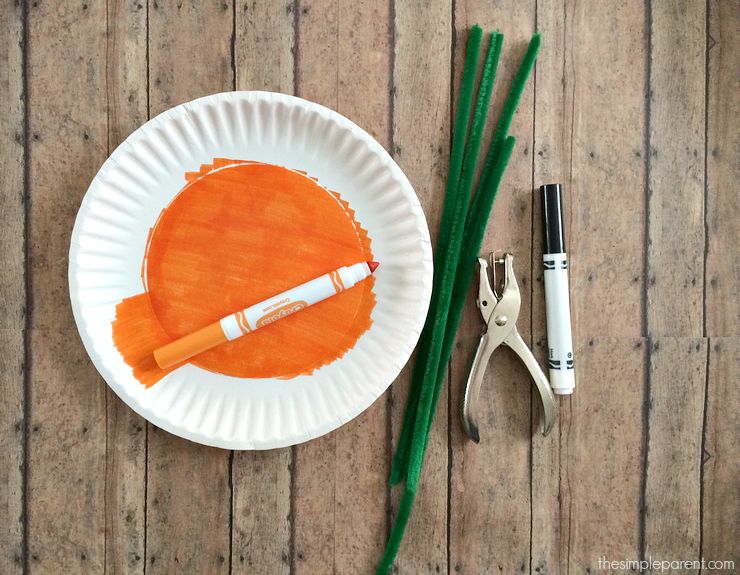 Learn how to make the easiest Paper Plate Pumpkin Craft ever! You probably have most of the supplies for this paper plate craft idea! It's a fun way to celebrate fall or Halloween with the kids!