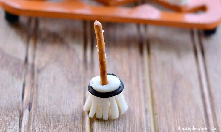 Make this Edible Witches Broomstick Craft as a fun Halloween snack idea for kids! This Halloween craft also doubles as a fun snack idea!