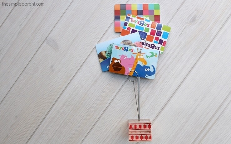 Turn your gift cards into a cute gift with this DIY Gift Card Holder! It's easy to make and adds a little something extra to your holiday gift cards!