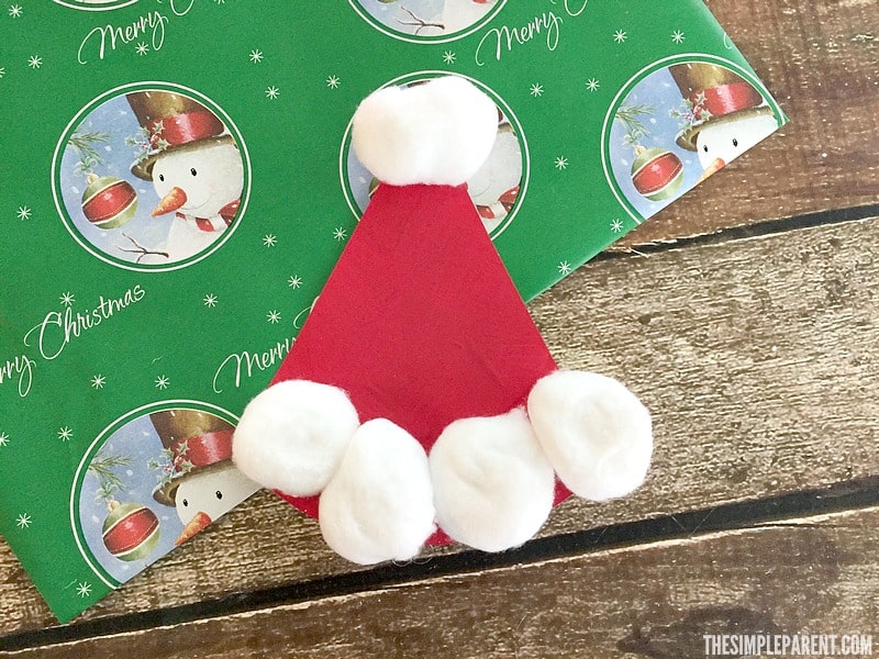 Make this easy paper plate Santa Hat craft with your kids this holiday season!