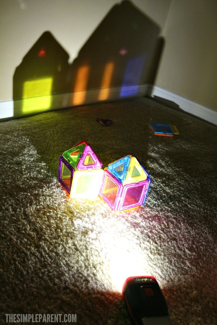 Encourage learning through play with these STEM preschool activities using a flashlight and colors!