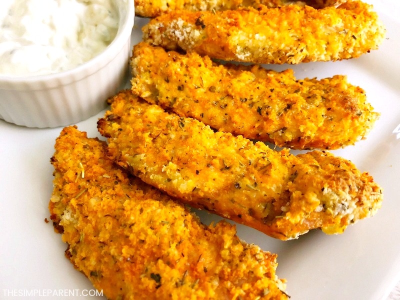 Buffalo Baked Chicken Tenders - These easy chicken strips are a healthy alternative to fried chicken nuggets. You make these homemade chicken fingers in the oven! If you like Panko bread crumbs, you'll love these!