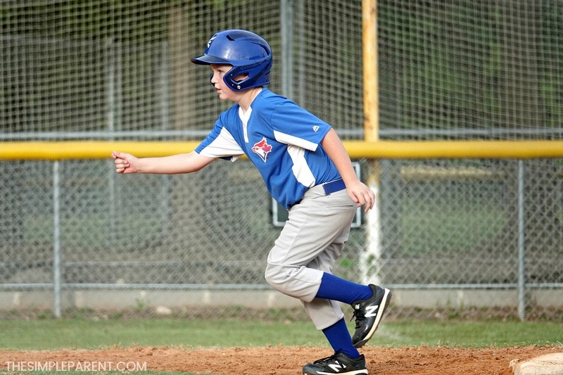 Child running the bases in a baseball game