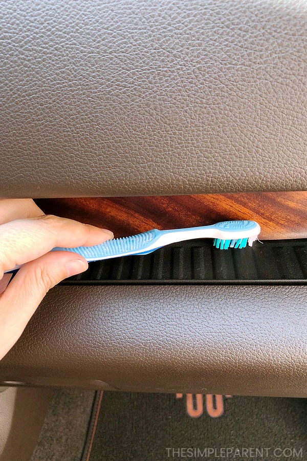 Car cleaning tricks using a toothbrush to scrub small spaces.