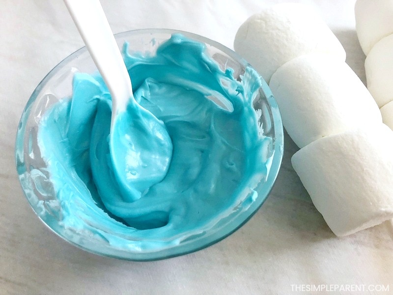 Melted blue candy melts to make marshmallow pops