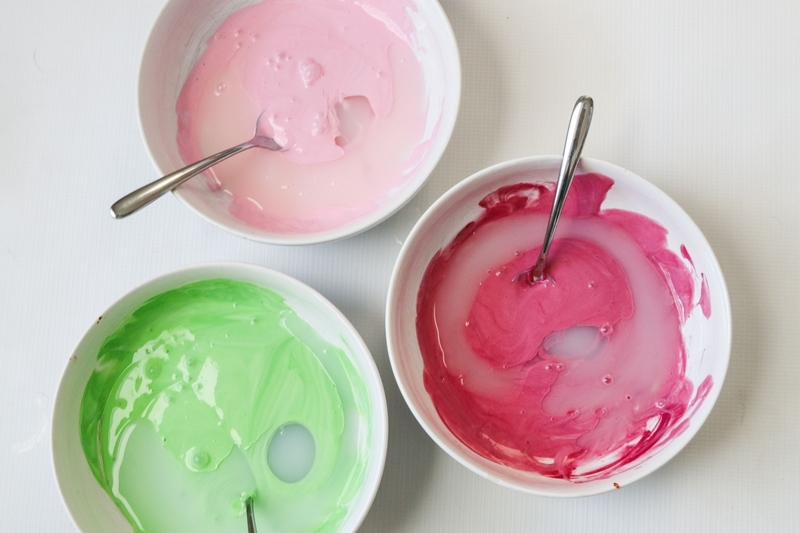 Multiple colored liquid starch slime in bowls
