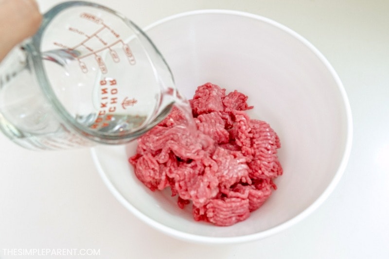 Ground beef in a bowl with water