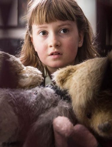 Bronte Carmichael with stuffed animals in Christopher Robin