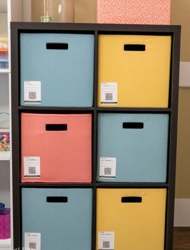 Organized shelf with bins and Duck Pack and Track labels