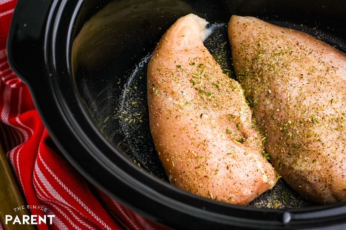 Chicken breasts in the Crockpot to make slow cooker chicken parm