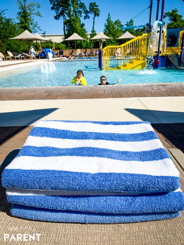 Stack of pool towels on a chair