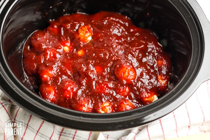 Frozen meatballs in a Crockpot with cranberry sauce and chili sauce