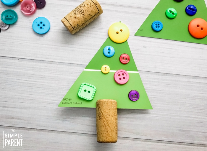 Green triangle with buttons glued on it to look like a Christmas tree