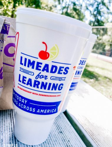 Limeades for Learning cup from SONIC Drive In sitting on picnic table