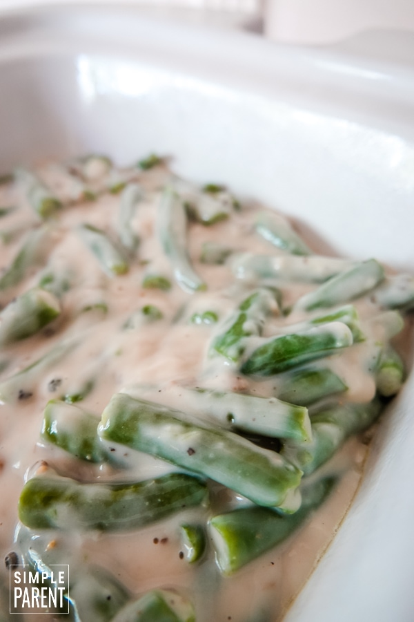 Green bean and mushroom soup mixture in the crock of the slow cooker