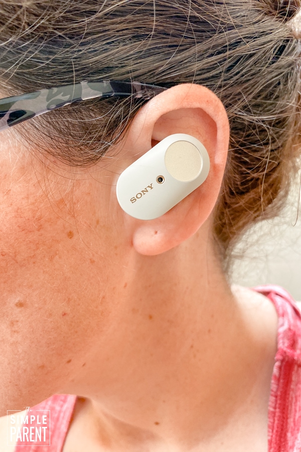 Woman wearing Sony In Ear Wireless Headphones in her ears
