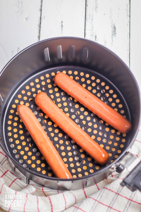 Hot dogs in an air fryer basket