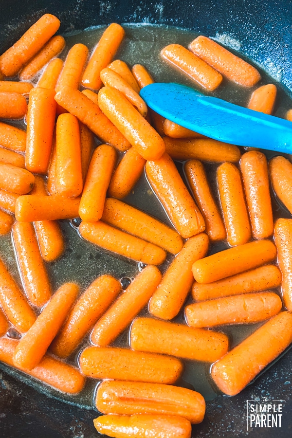 Baby carrots cooking on the stovetop