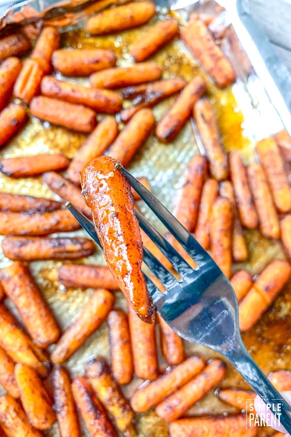 One glaze baby carrot on a fork