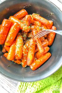 Bowl of Brown Sugar Roasted Carrots with a fork