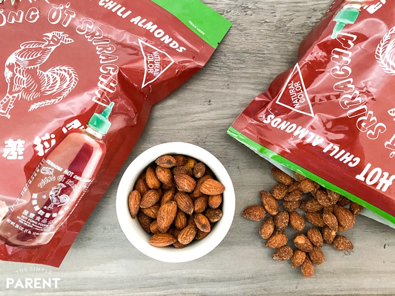 Huy Fong Original Sriracha Almonds in a bowl and in the bag on a counter