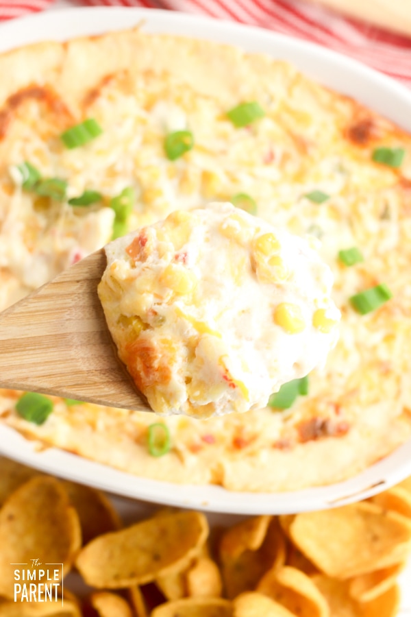 Wooden spoon of Mexican Corn Dip with green onions