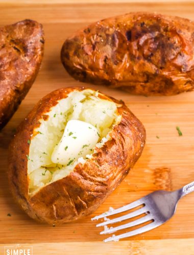Air Fryer Baked Potato with butter and a fork
