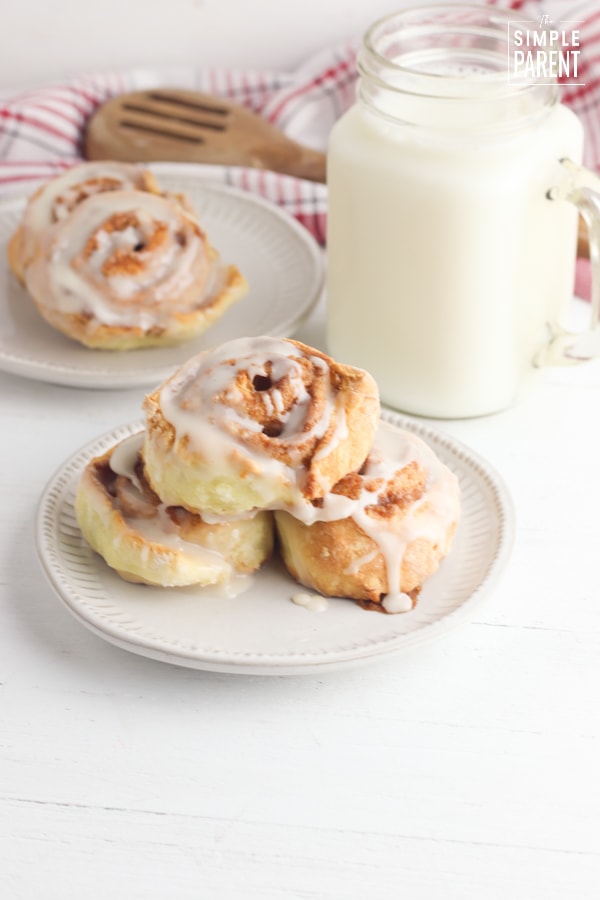 Plate of cinnamon rolls made with Bisquick and a glass of milk