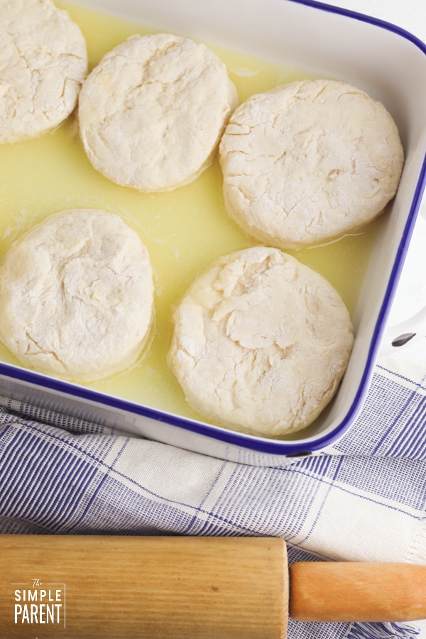 Sour cream biscuits in dish with melted butter