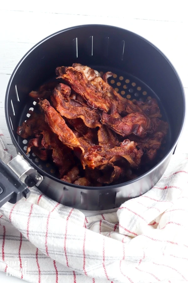 Crispy cooked bacon in air fryer basket