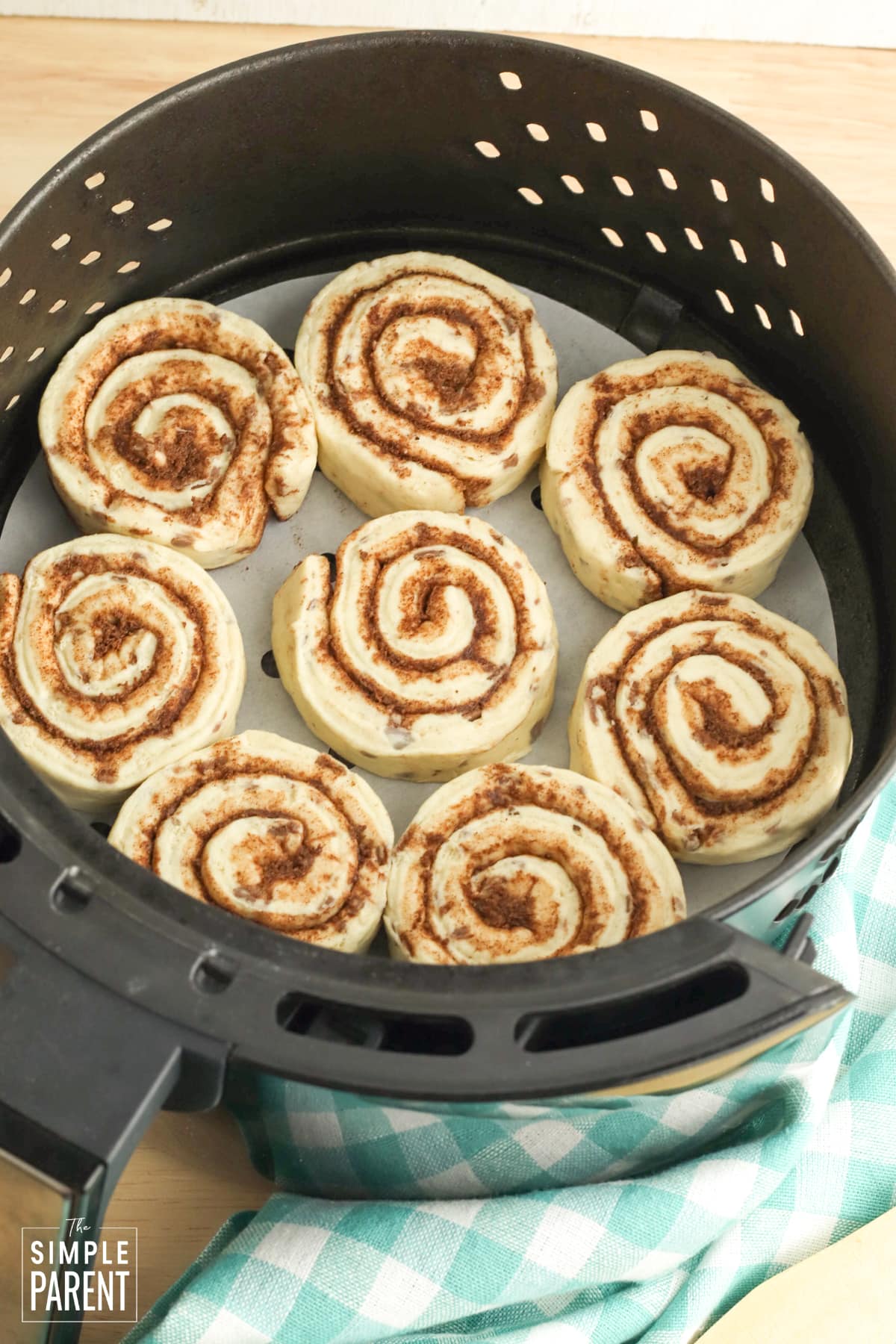 Refrigerated cinnamon rolls in air fryer basket