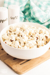 Air Fryer Popcorn in white bowl on cutting board