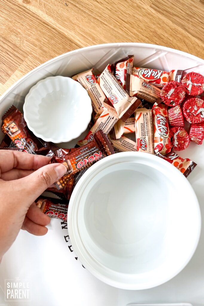 Putting candy on candy tray