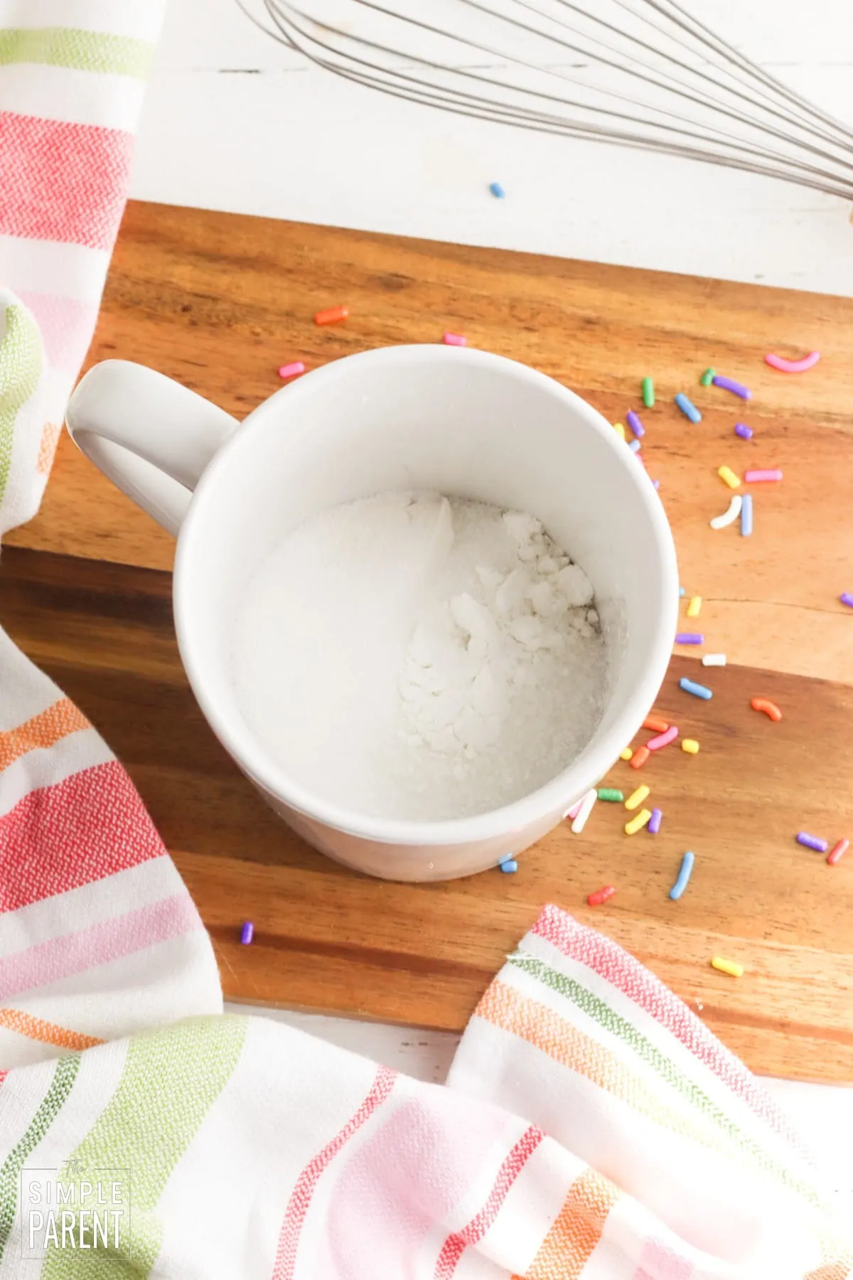 Flour and sugar in white mug