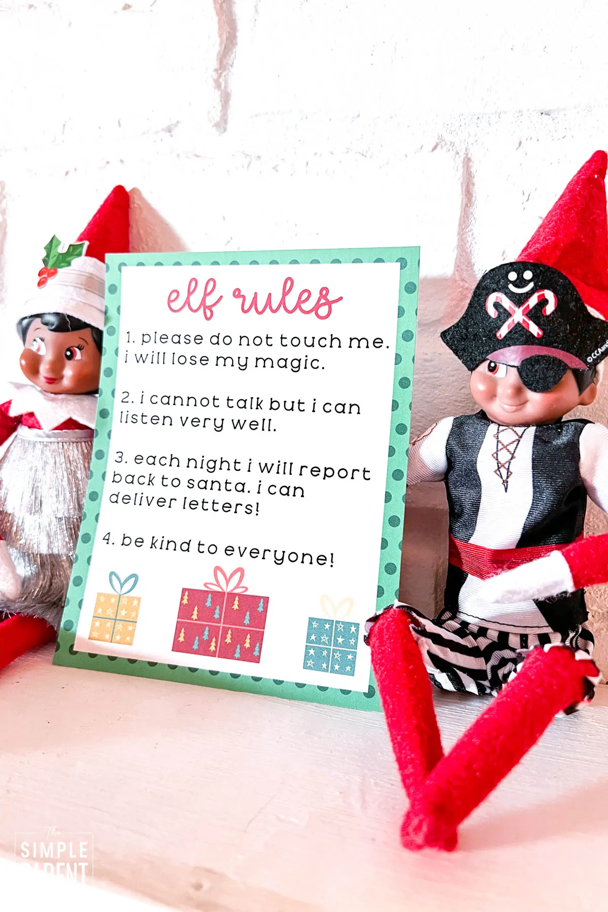 Elf on the shelf dressed as a pirate sitting on fireplace mantle