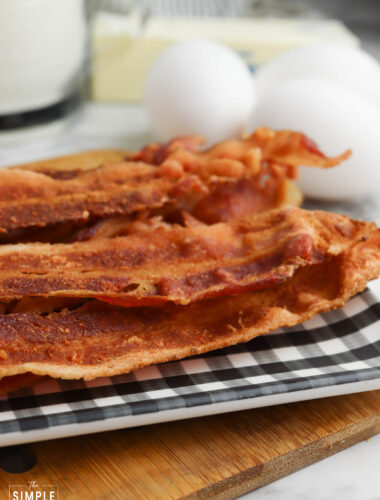 Crispy microwave bacon on a black and white serving plate