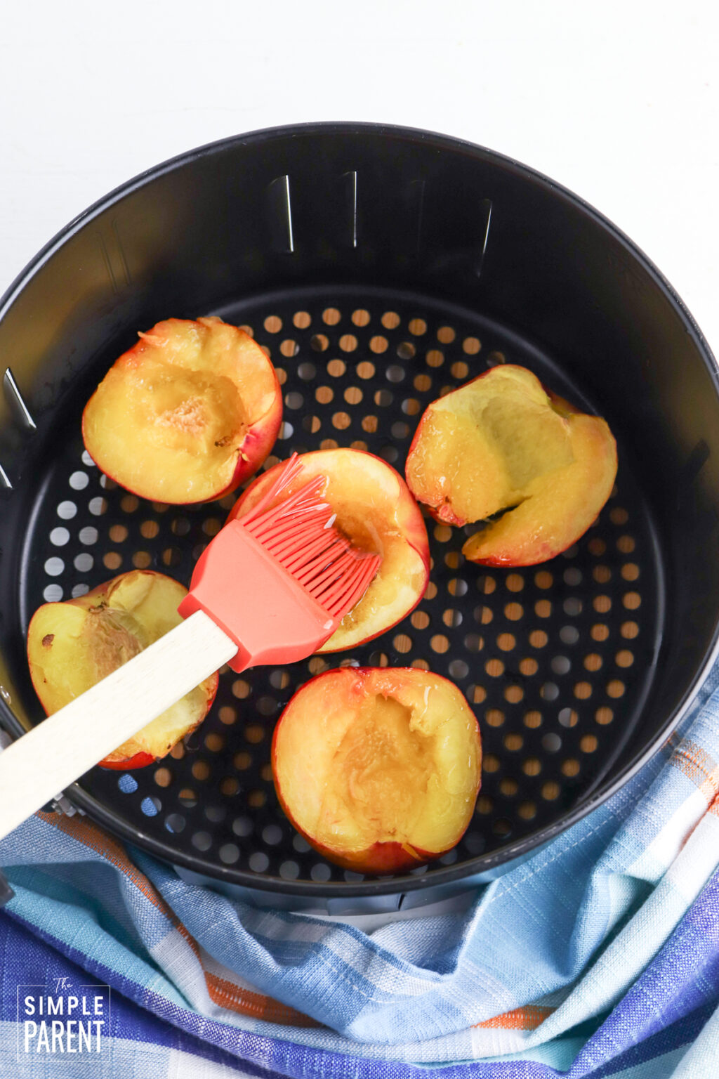 Air Fryer Peaches • The Simple Parent