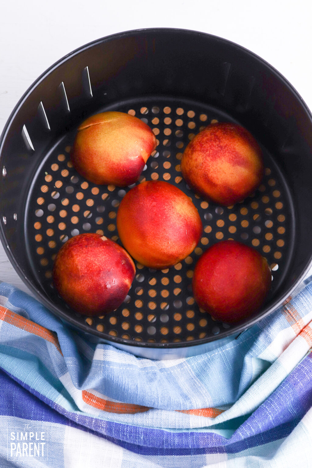 Air Fryer Peaches • The Simple Parent