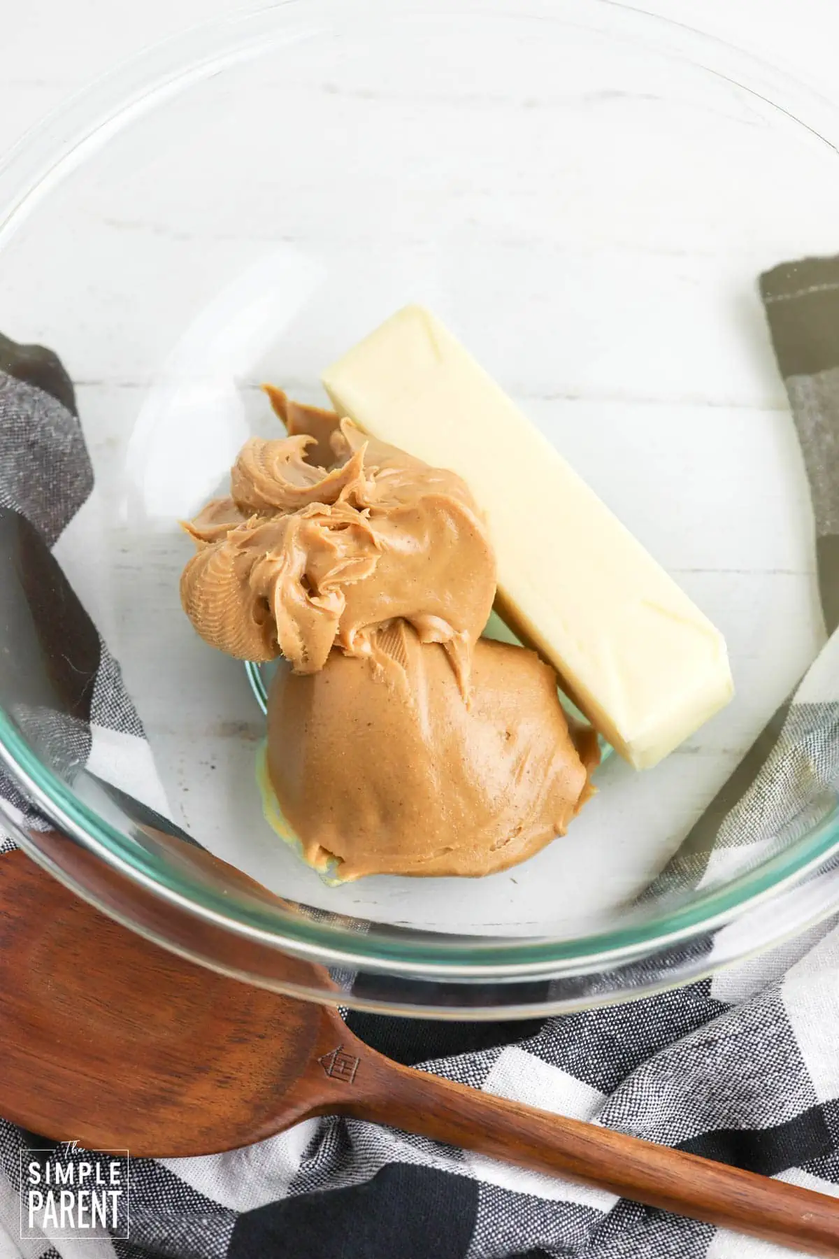 Peanut butter and butter in glass mixing bowl