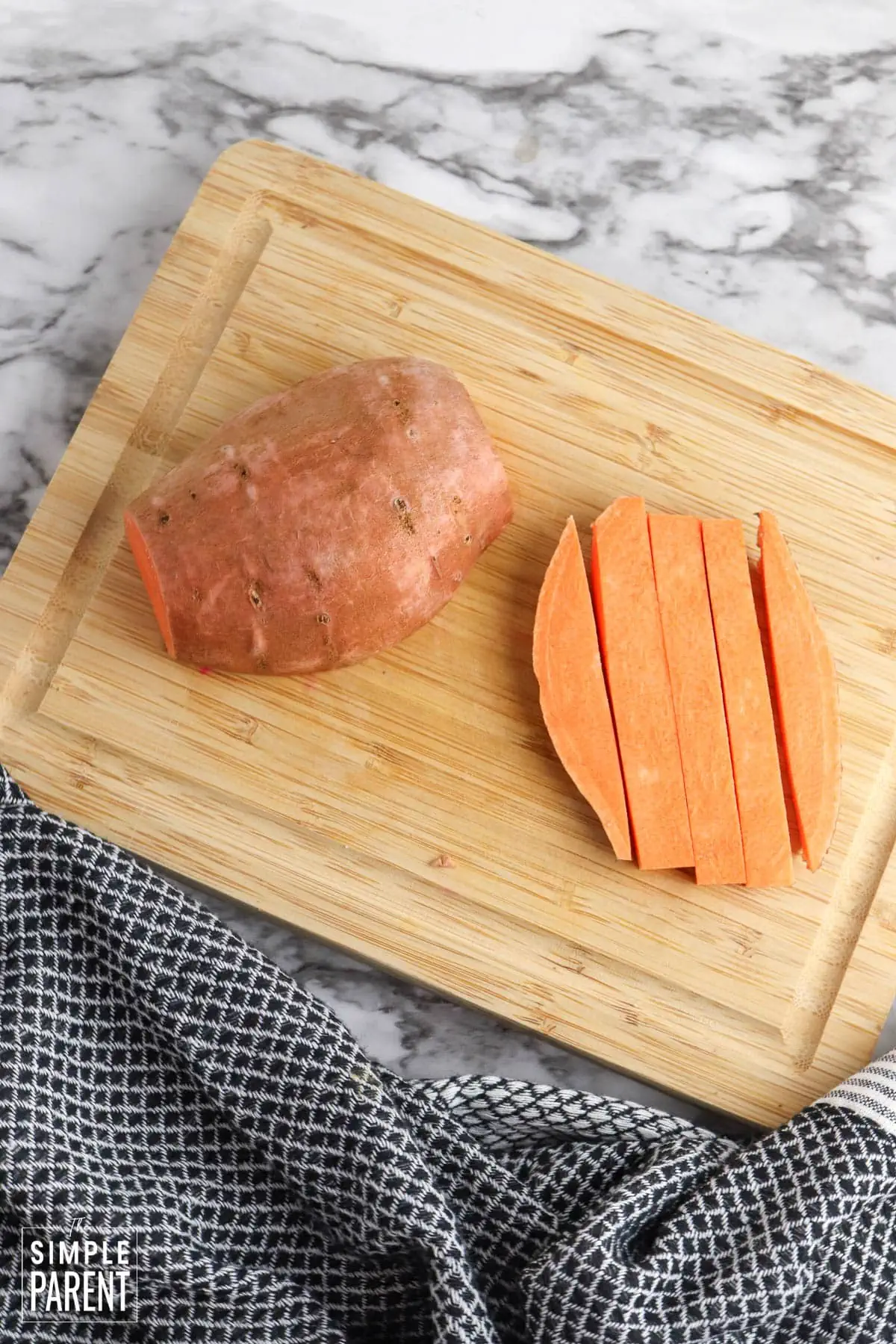 Sweet potato on wooden cutting board