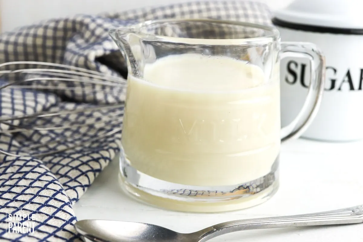 Homemade condensed milk in a glass cup