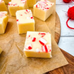 Pieces of Peppermint Fudge on wooden serving baord