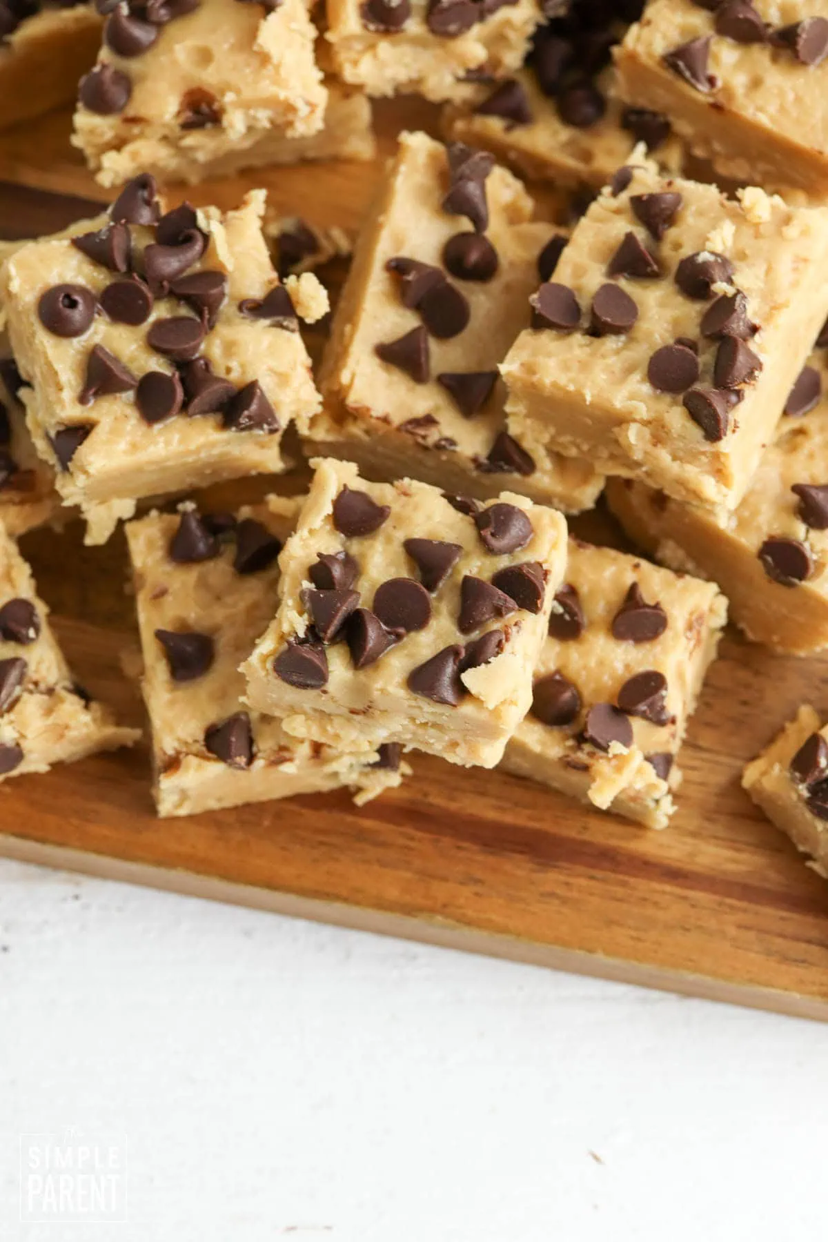 Christmas 3 ingredient peanut butter fudge on wooden dish
