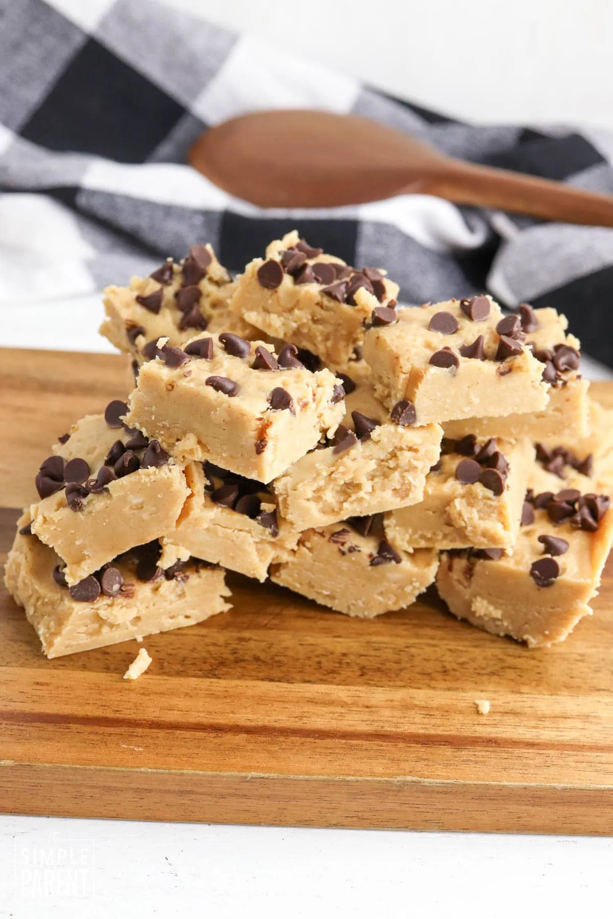 Pieces of Christmas chocolate peanut butter fudge on wooden serving board
