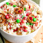 Christmas popcorn snack mix in white bowl