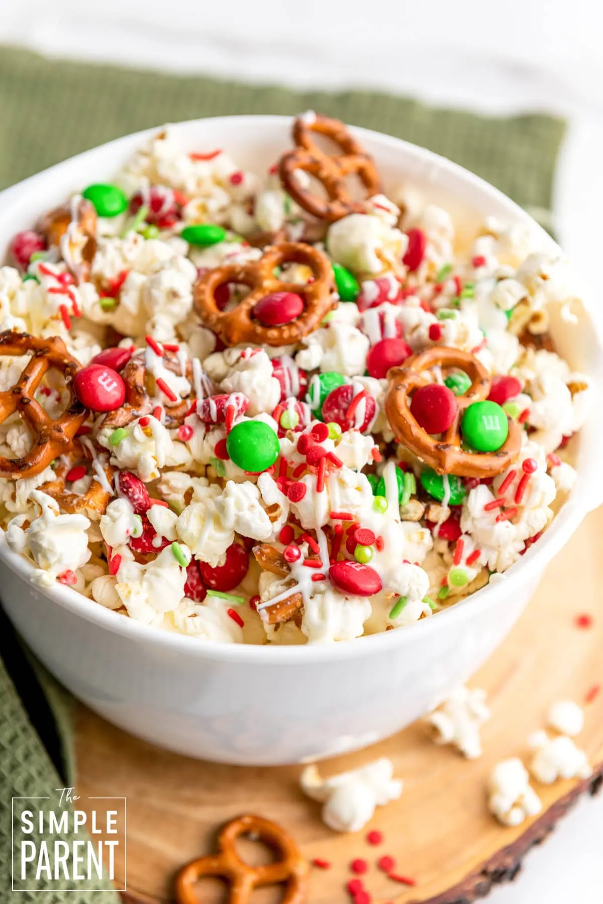 Christmas popcorn snack mix in white bowl
