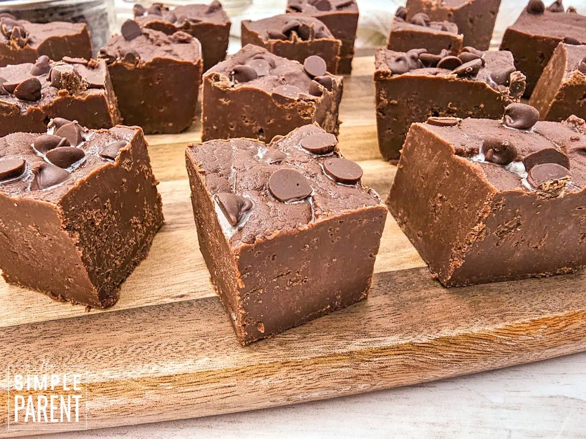 simple chocolate fudge pieces on wooden cutting baord