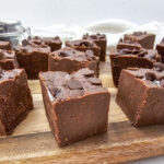 Pieces of chocolate fudge on wooden cutting board